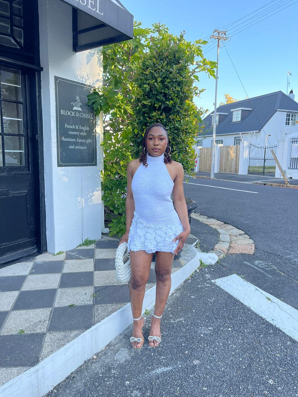 Mervie in a full-length crochet dress